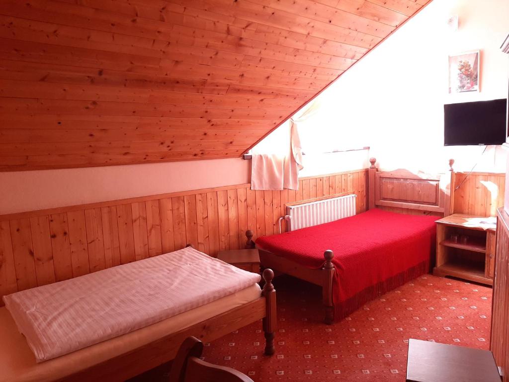 Postel nebo postele na pokoji v ubytování garni Hotel ASAS***