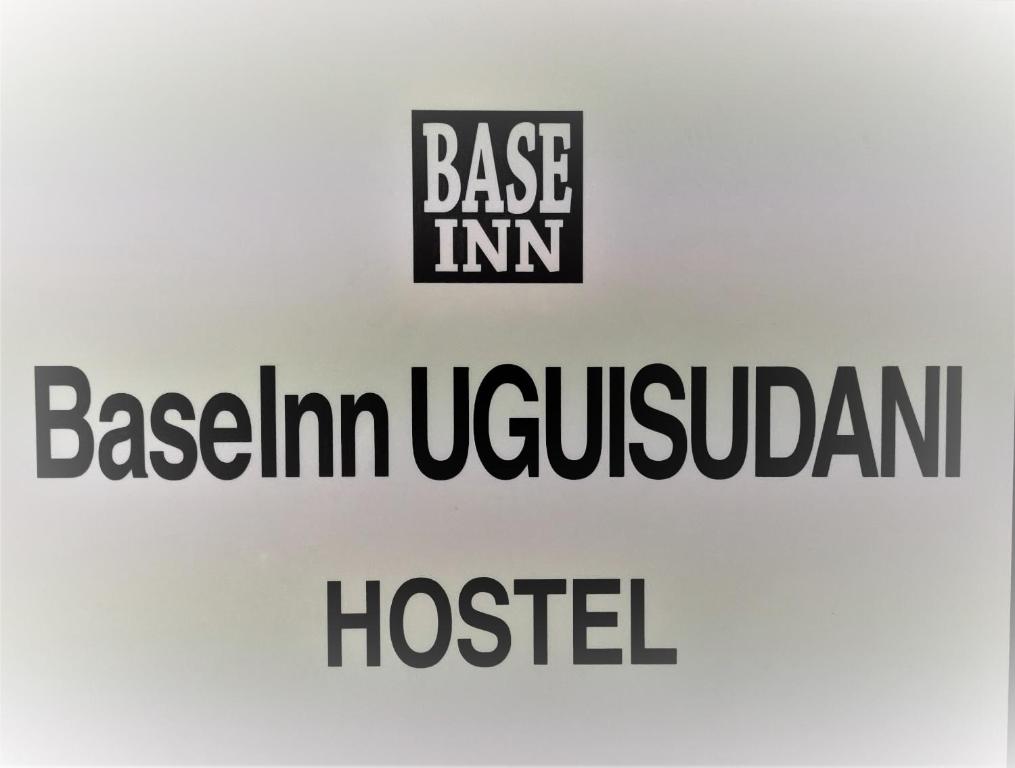 a sign that says base inn in berlin ukrainian hospital at Base Inn Uguisudani in Tokyo