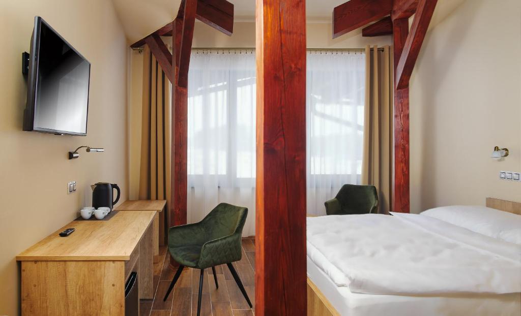 TV a/nebo společenská místnost v ubytování Hotel Dymník