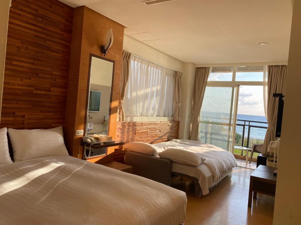 Postel nebo postele na pokoji v ubytování LoveSea 126 Beach Inn