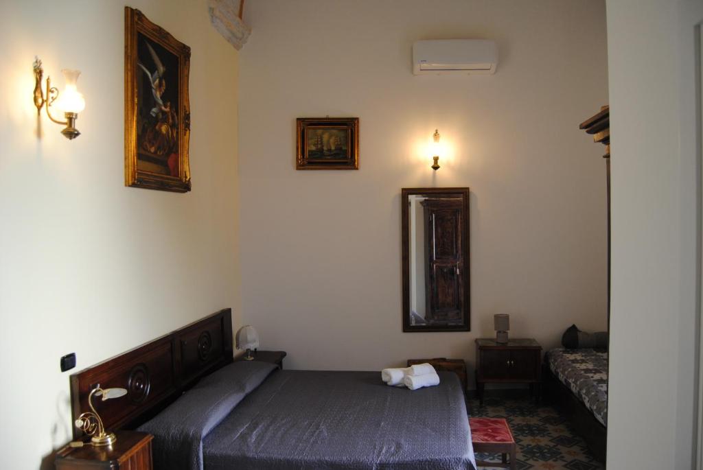 A bed or beds in a room at B & B Palazzo Maestro & Corte Maestro rooms