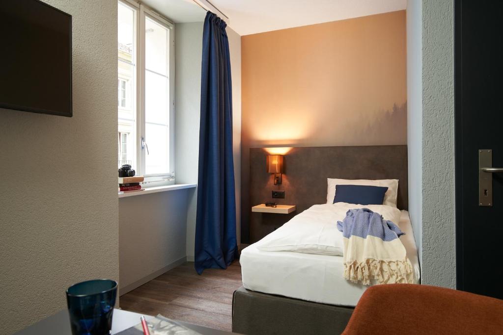 Postel nebo postele na pokoji v ubytování The HEY HOTEL