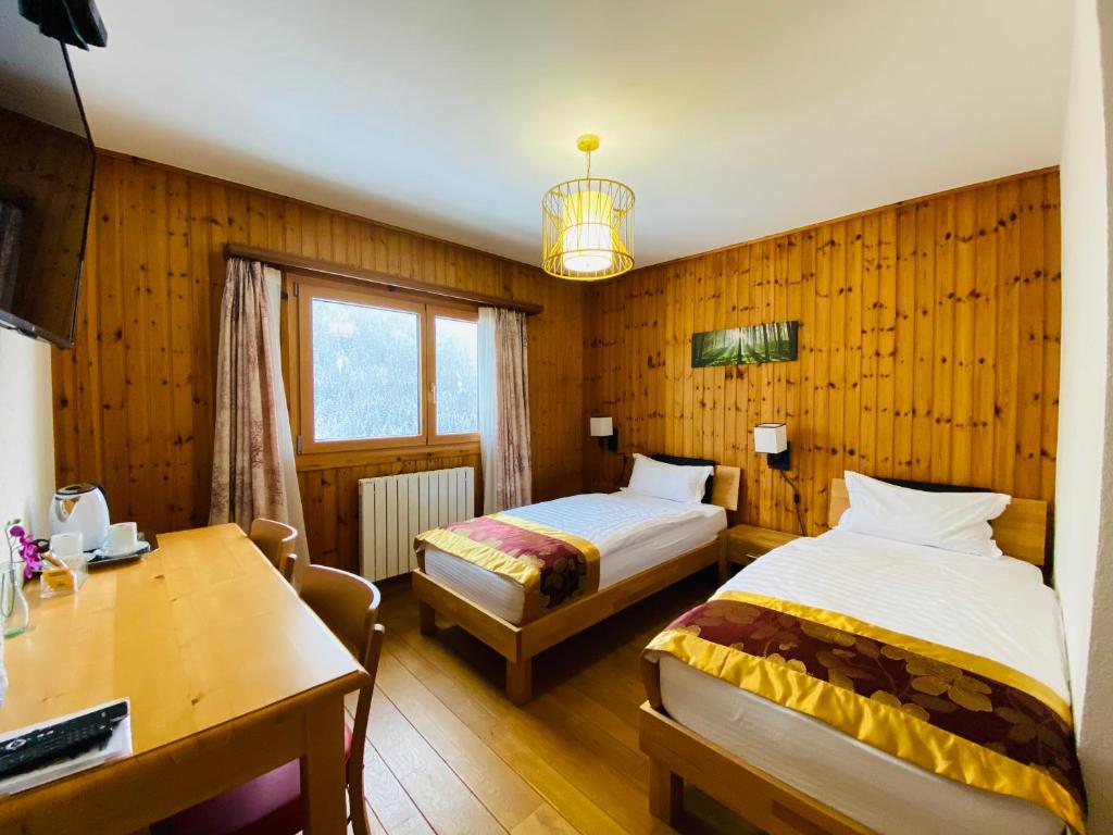 Postel nebo postele na pokoji v ubytování Qi-Lin Hotel Restaurant