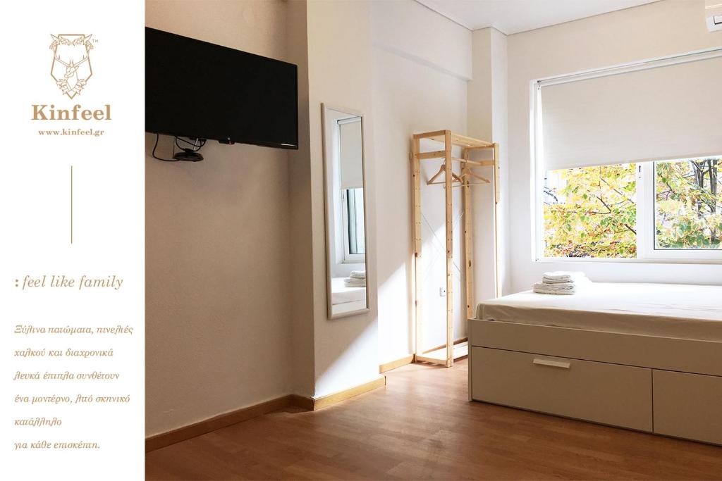 a bedroom with a bed and a window at Kinfeels' downtown apartment B2 in Larisa