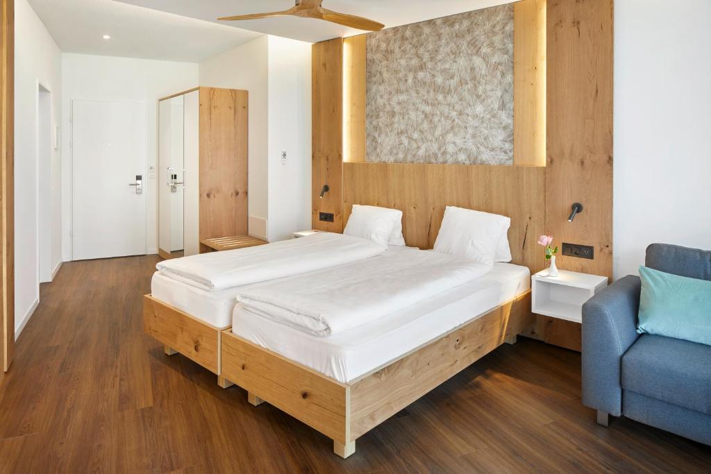 Postel nebo postele na pokoji v ubytování Hotel Rössli Gourmet & Spa