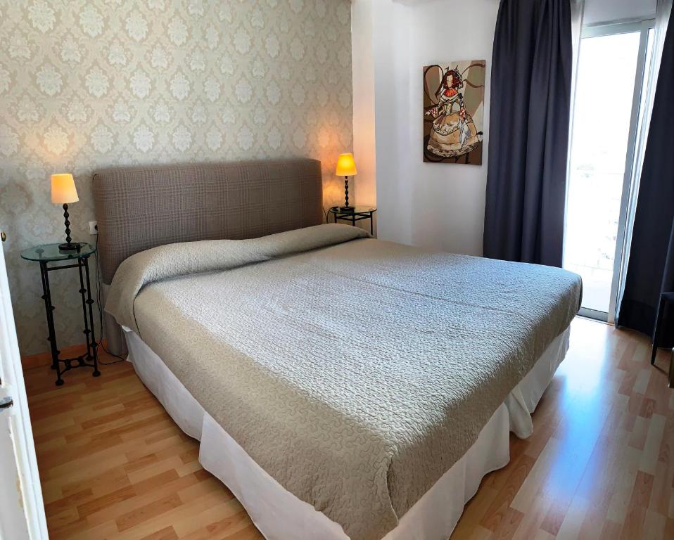 Postel nebo postele na pokoji v ubytování Apartamentos Bruja