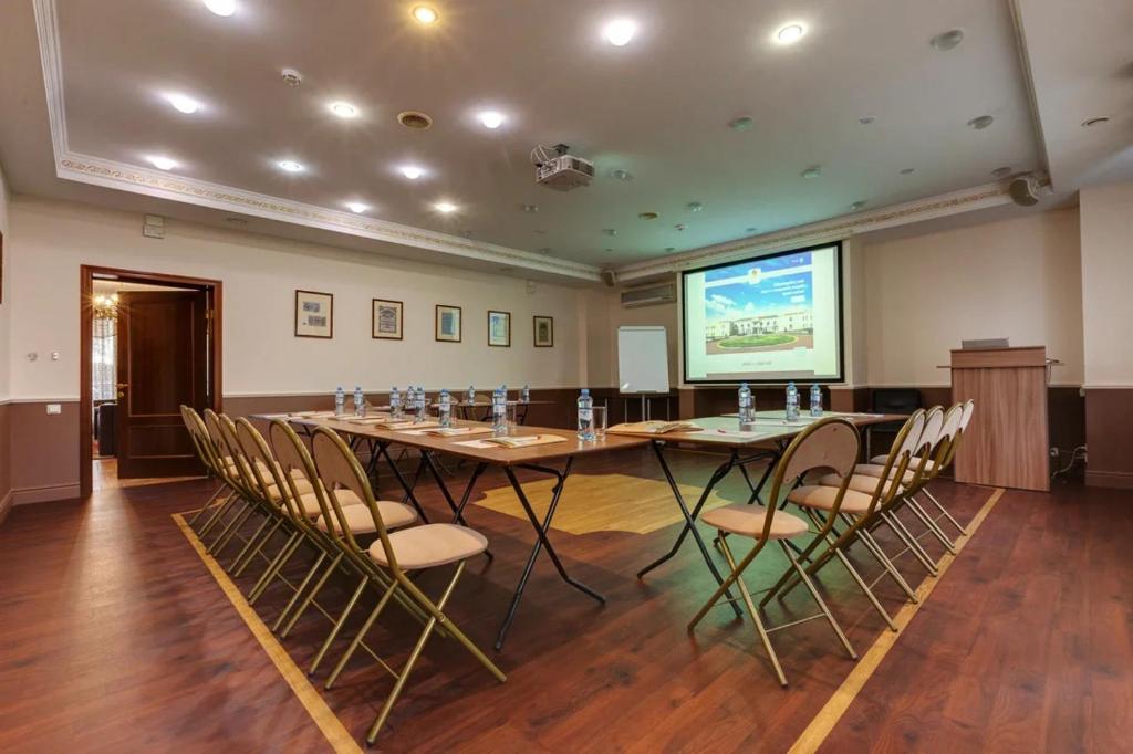 a large conference room with a large table and chairs at Grand Peterhof Spa Hotel in Petergof