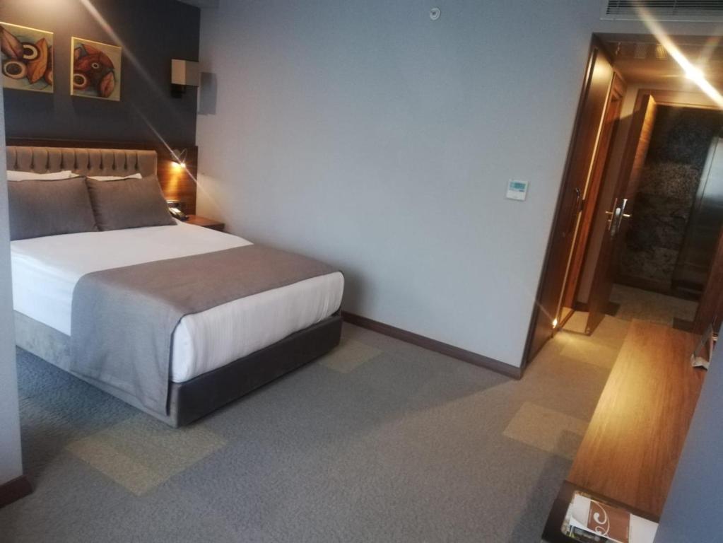 Postel nebo postele na pokoji v ubytování Oytun Park Hotel