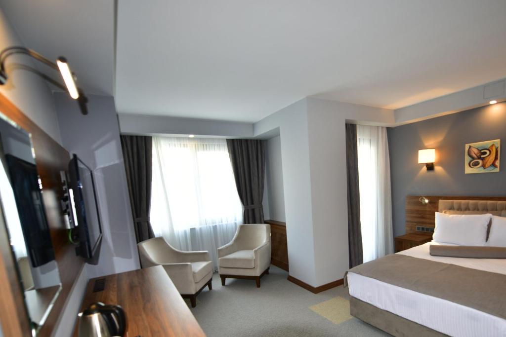 TV a/nebo společenská místnost v ubytování Oytun Park Hotel