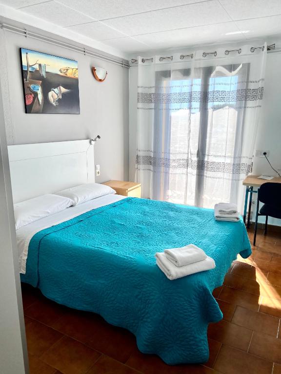 Postel nebo postele na pokoji v ubytování Hotel Les Roques