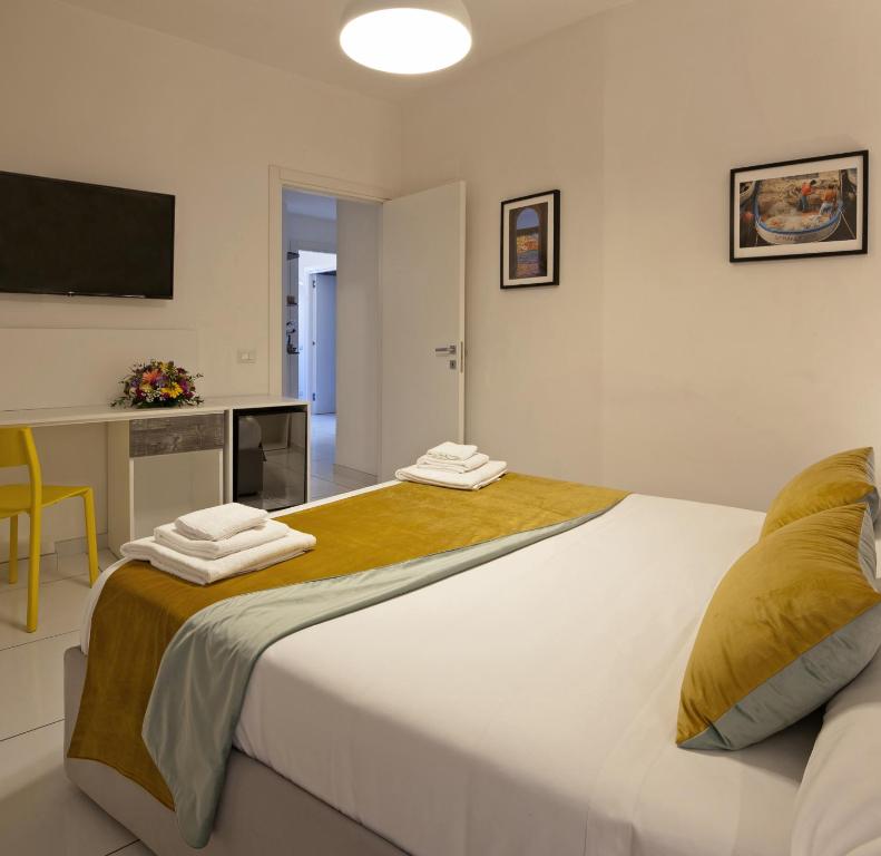 Postel nebo postele na pokoji v ubytování YourHome - Maison Nonna Anna
