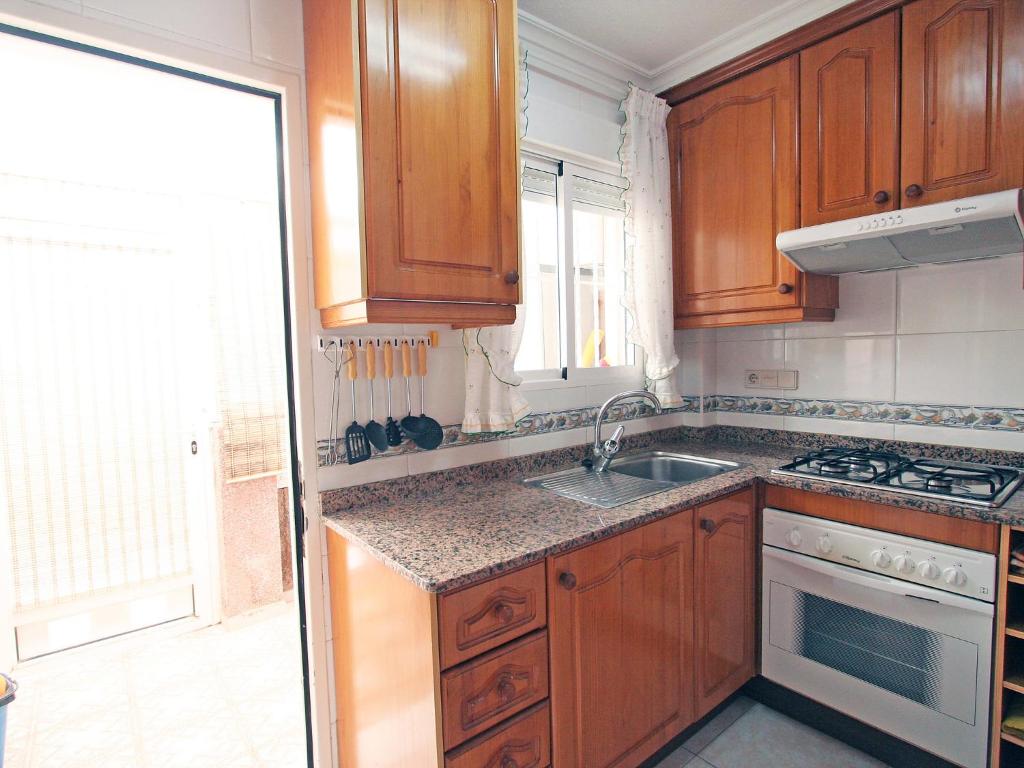A kitchen or kitchenette at Holiday Home Tamarit Beach by Interhome