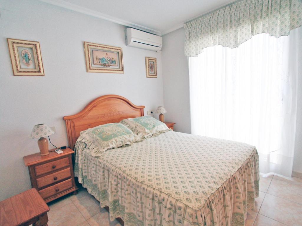 A bed or beds in a room at Holiday Home Tamarit Beach by Interhome