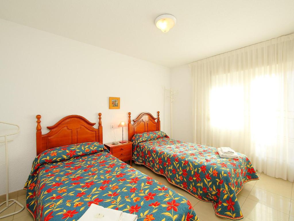 Postel nebo postele na pokoji v ubytování Apartment Giner by Interhome