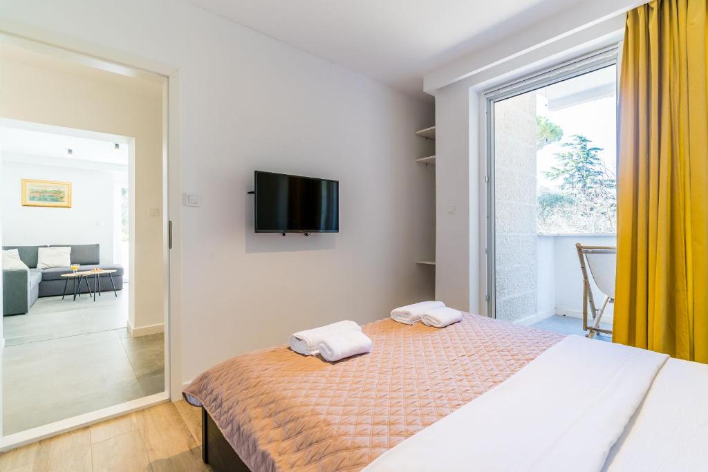 Postel nebo postele na pokoji v ubytování Lapad bay luxury apartment
