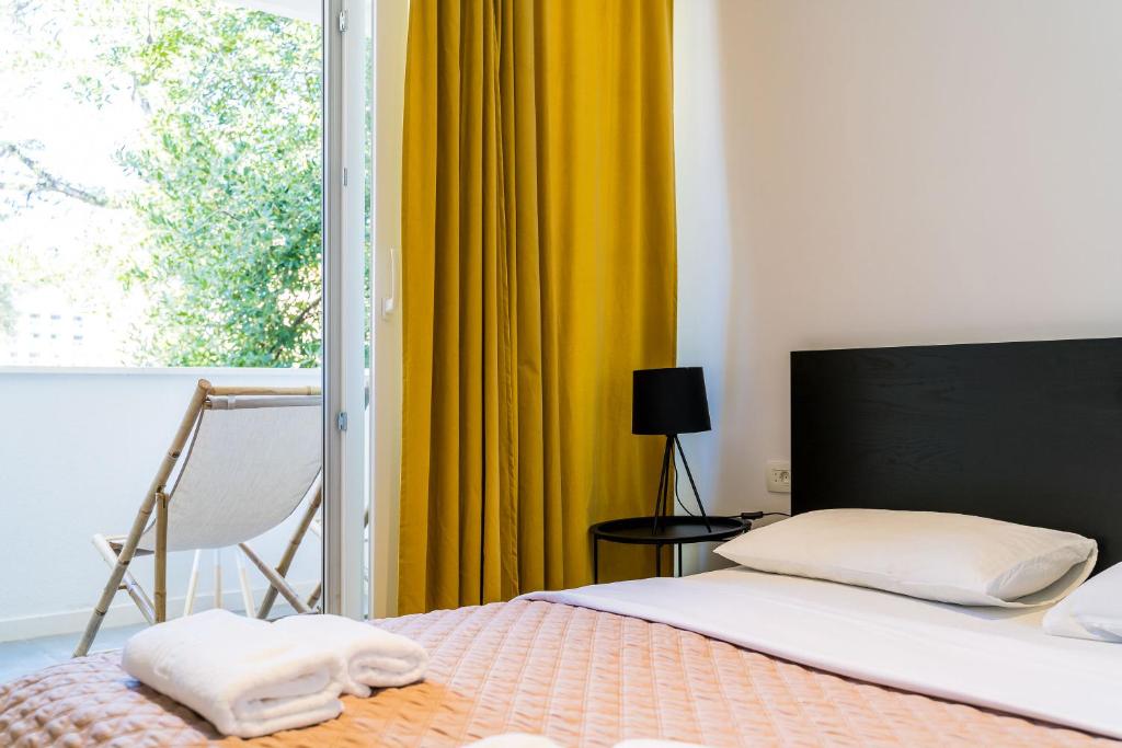 Postel nebo postele na pokoji v ubytování Lapad bay luxury apartment