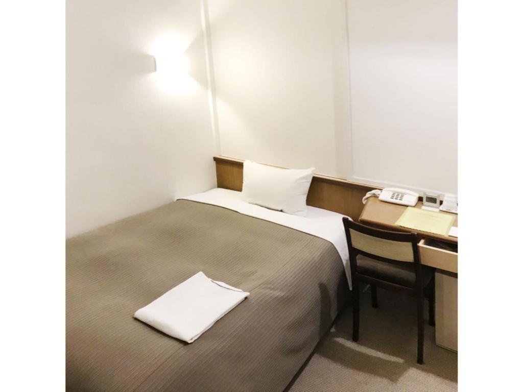 Llit o llits en una habitació de Grand Park Hotel Excel Fukushima Ebisu / Vacation STAY 77713
