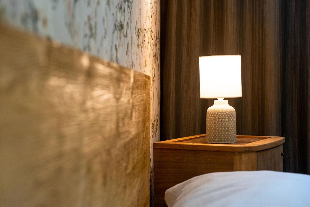 Postel nebo postele na pokoji v ubytování Hotel Kouty