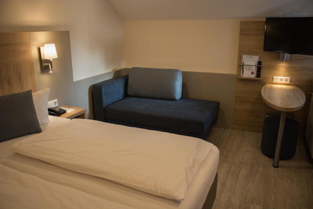 Postel nebo postele na pokoji v ubytování Hotel Rosenbusch
