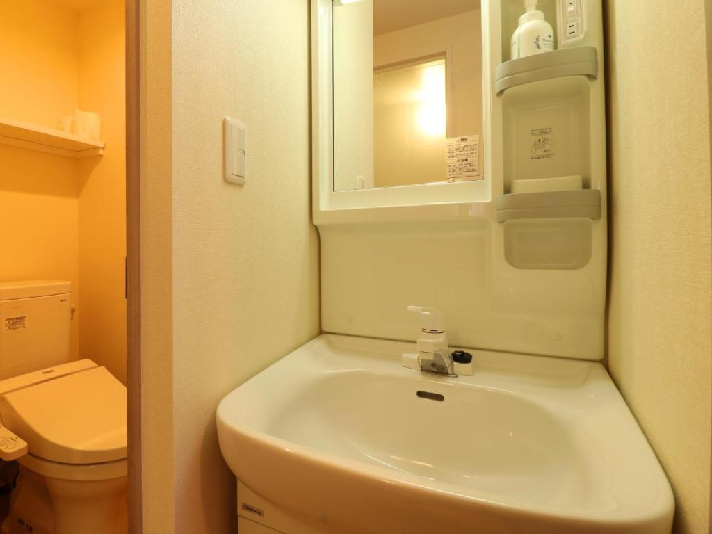 Koupelna v ubytování Hotel Asahi Grandeur Fuchu
