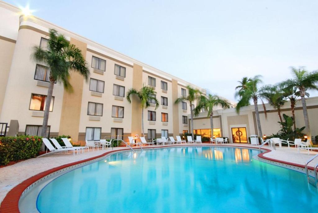 a large swimming pool in front of a building at Holiday Inn - Fort Myers - Downtown Area, an IHG Hotel in Fort Myers