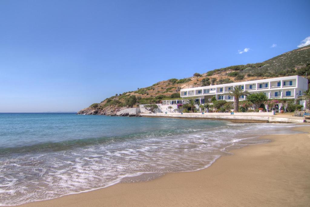 a view of the beach in front of buildings at Platys Gialos Hotel Sifnos in Platis Gialos