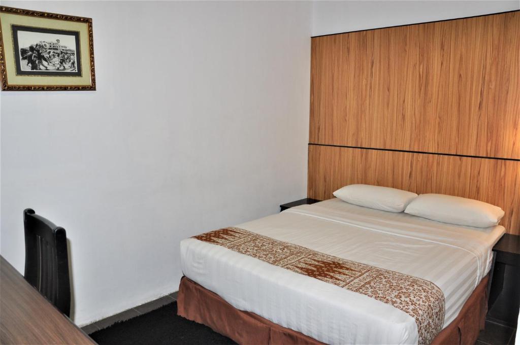 Postel nebo postele na pokoji v ubytování Sipadan Inn 1
