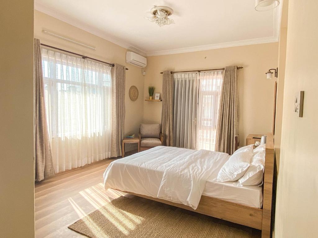 Postel nebo postele na pokoji v ubytování Kibu Home