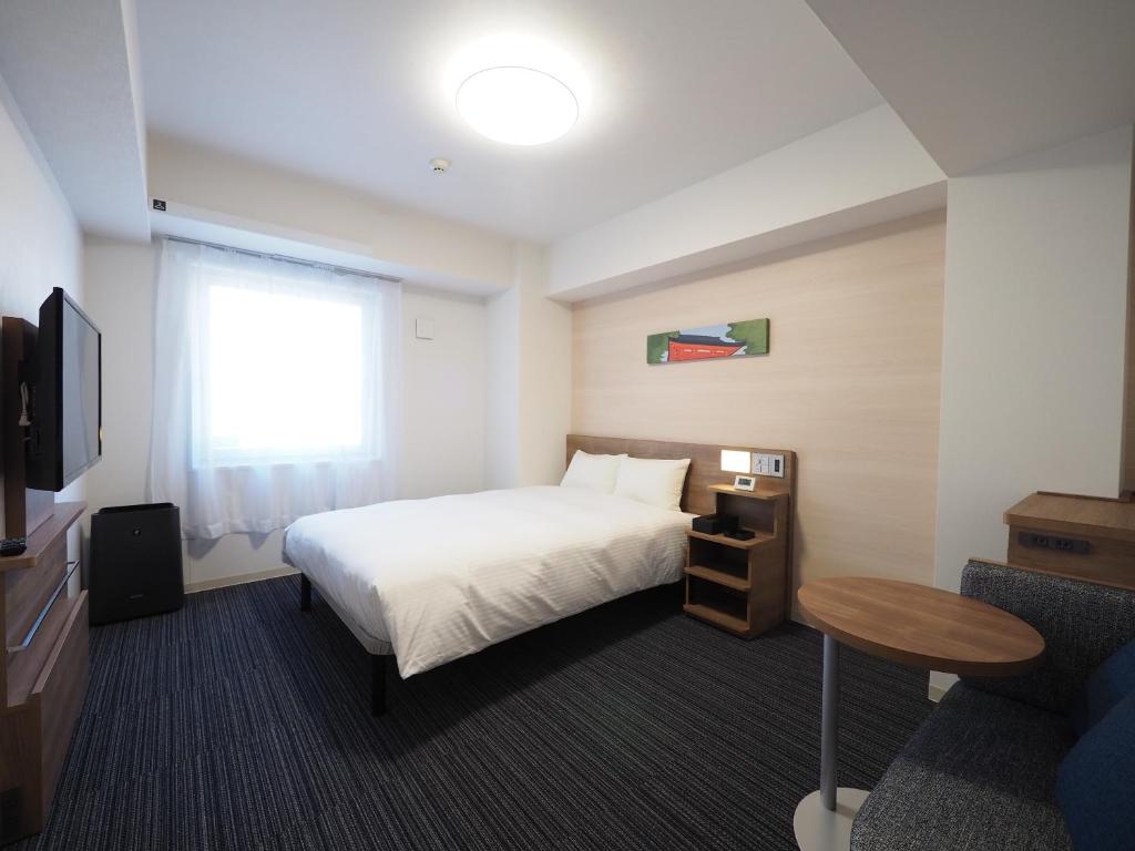 Postel nebo postele na pokoji v ubytování Tabino Hotel Kashima