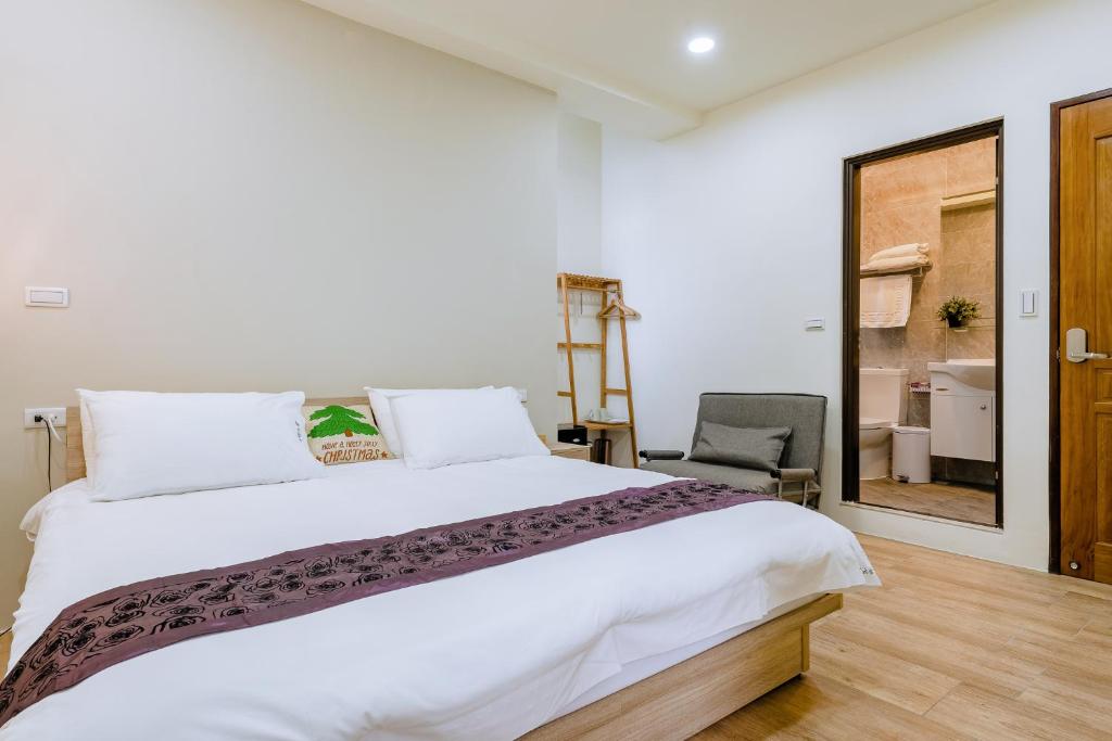 Ένα ή περισσότερα κρεβάτια σε δωμάτιο στο ChingTian YunShe Homestay