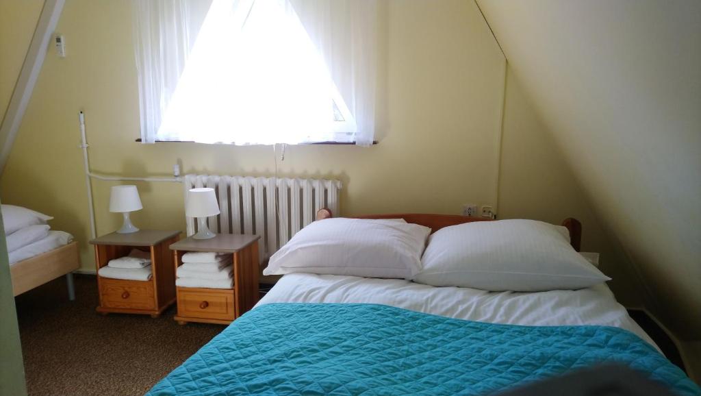 Postel nebo postele na pokoji v ubytování Zajazd Ustronie