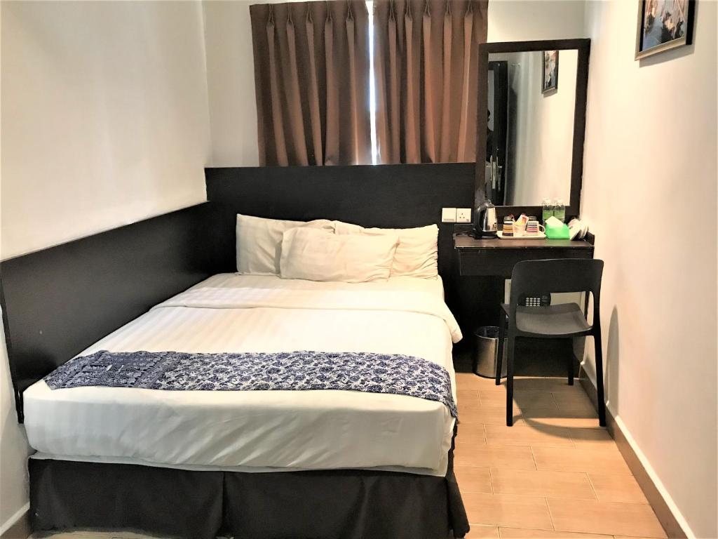 Postel nebo postele na pokoji v ubytování Sipadan Inn 2