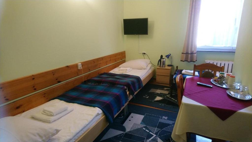 Postel nebo postele na pokoji v ubytování Zajazd Ustronie