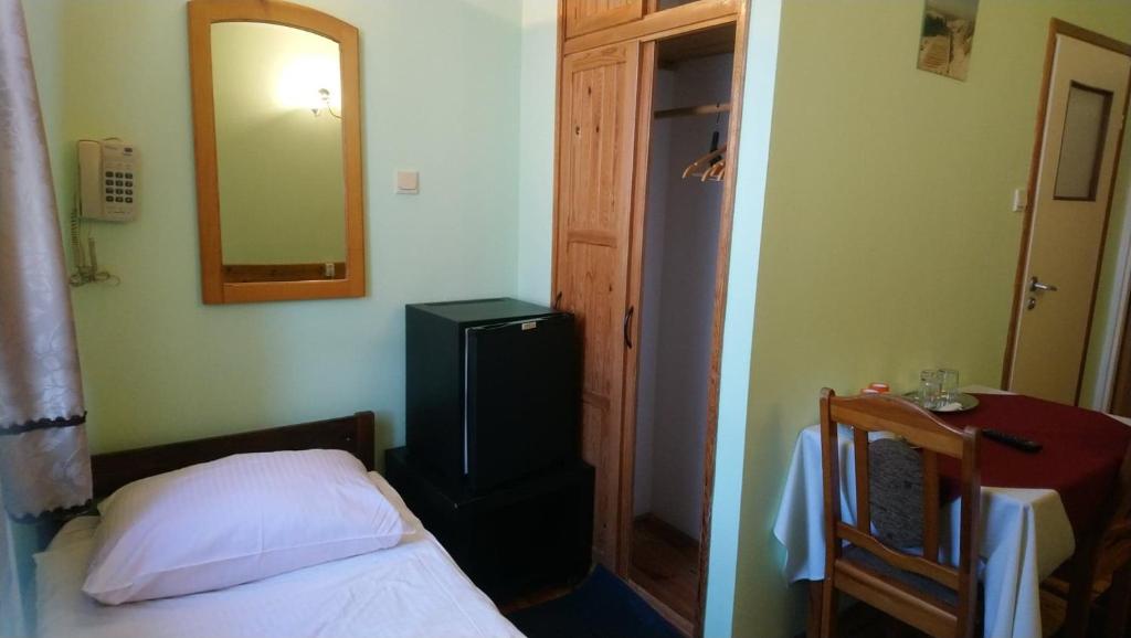 Postel nebo postele na pokoji v ubytování Zajazd Ustronie