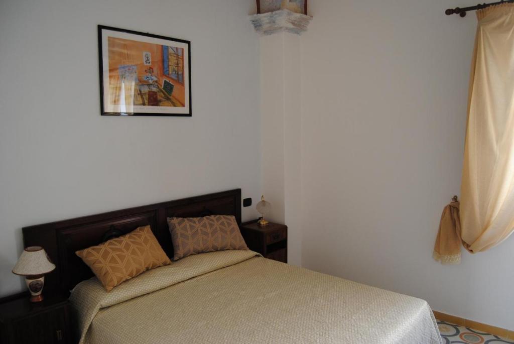 A bed or beds in a room at B & B Palazzo Maestro & Corte Maestro rooms