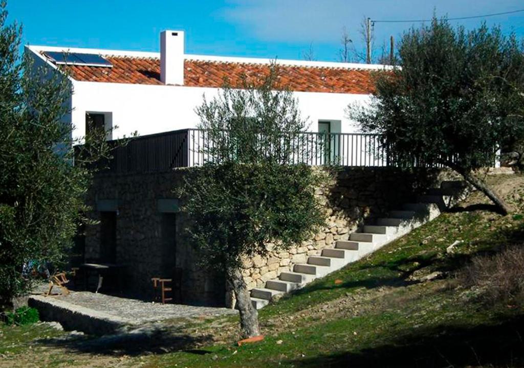 a house with a staircase in front of it at ALENTEJO Mountain Vacation House in Castelo de Vide