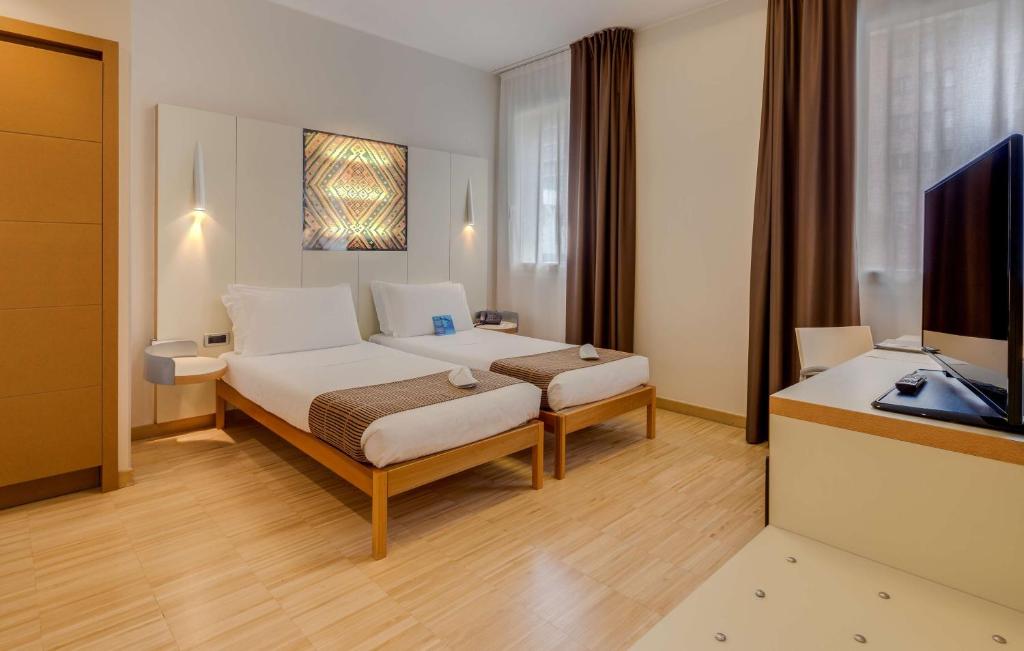 Postel nebo postele na pokoji v ubytování Best Western Plus Hotel Bologna