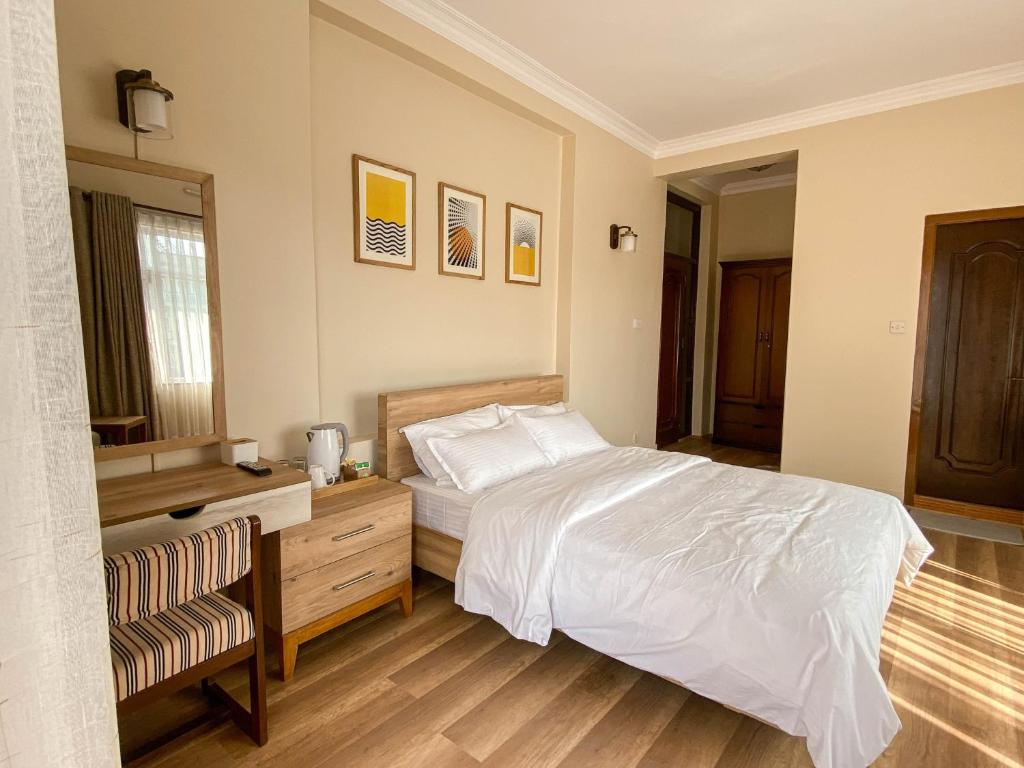 Postel nebo postele na pokoji v ubytování Kibu Home