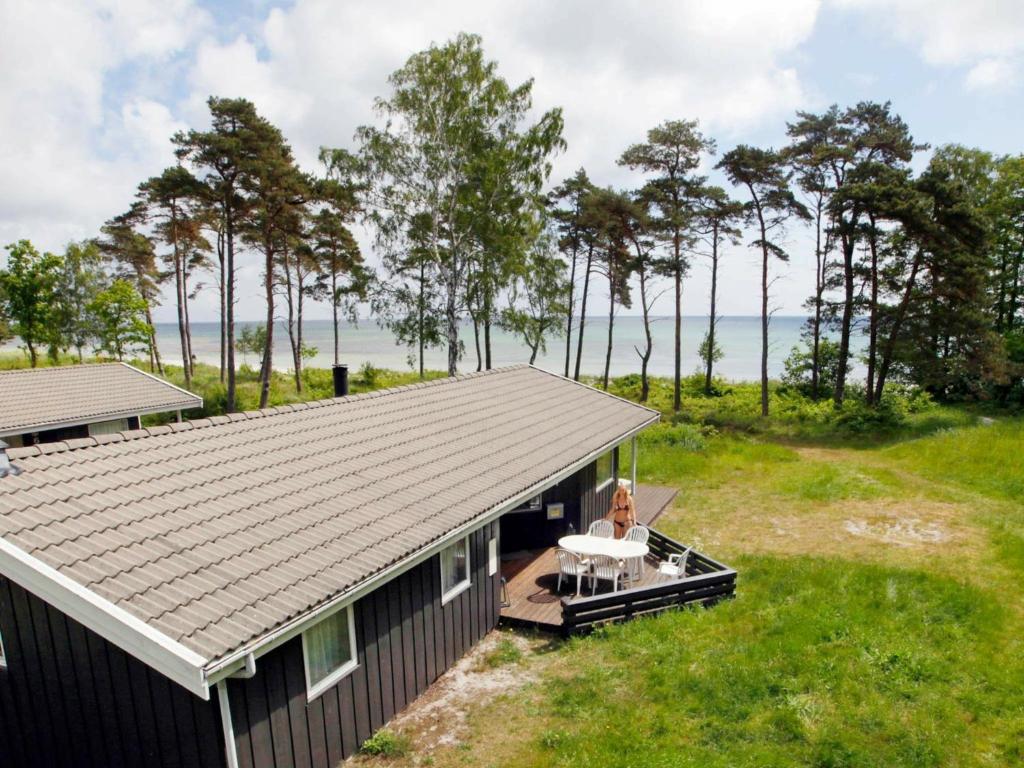 an aerial view of a house with a deck at Cozy Holiday Home in Nexo with Sauna in Snogebæk