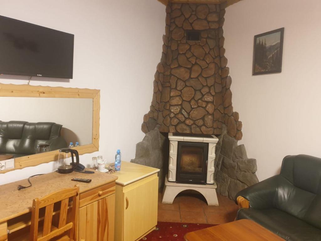 Televízia a/alebo spoločenská miestnosť v ubytovaní Wisła Mountain SPA