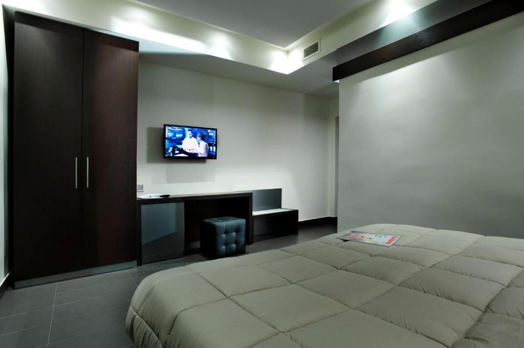 TV a/nebo společenská místnost v ubytování Hotel Ristorante Borgo Antico