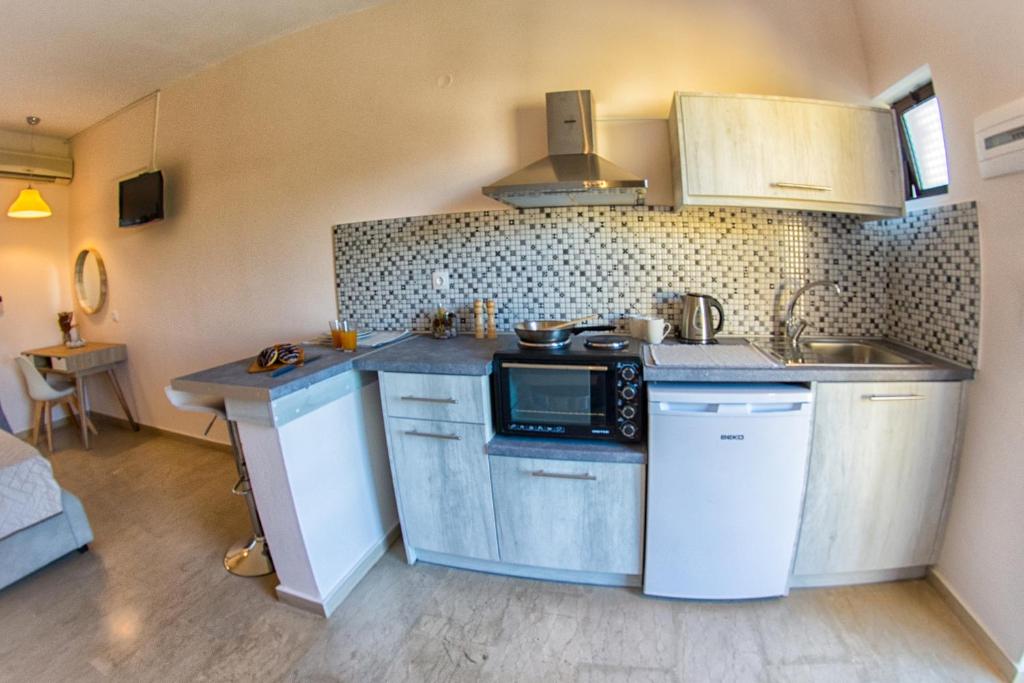 Kuchnia lub aneks kuchenny w obiekcie Costas apartments
