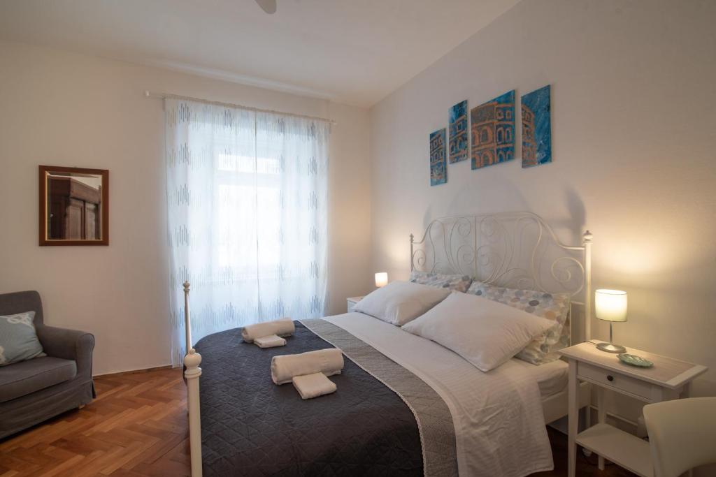 Postel nebo postele na pokoji v ubytování TTapartmani