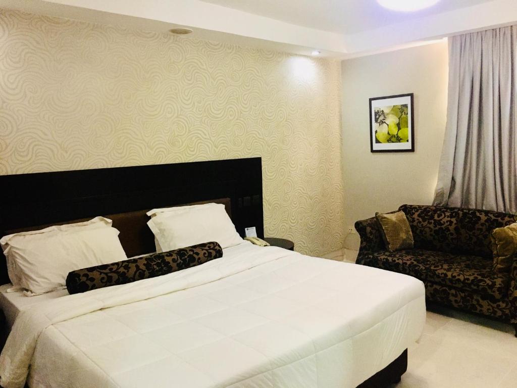 Postel nebo postele na pokoji v ubytování BW Starfire Hotel