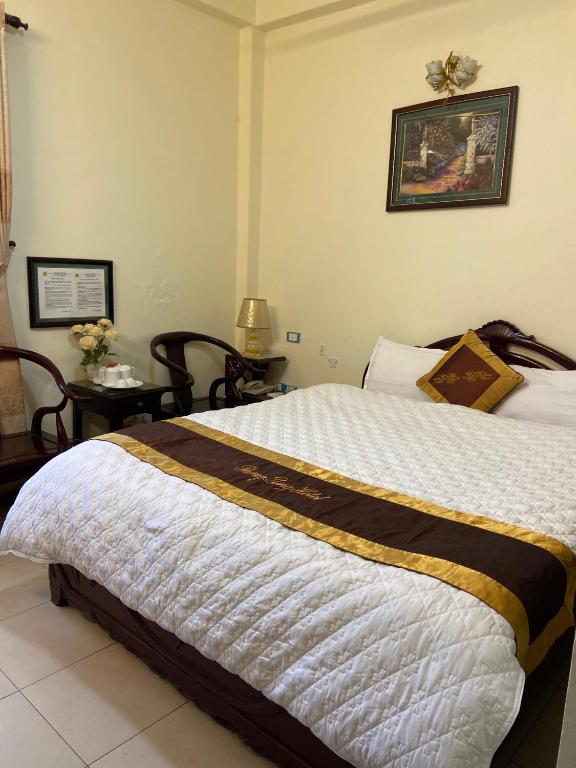 Postel nebo postele na pokoji v ubytování Thang Long Hotel