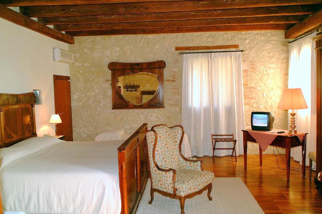 Łóżko lub łóżka w pokoju w obiekcie Agriturismo Le Vescovane