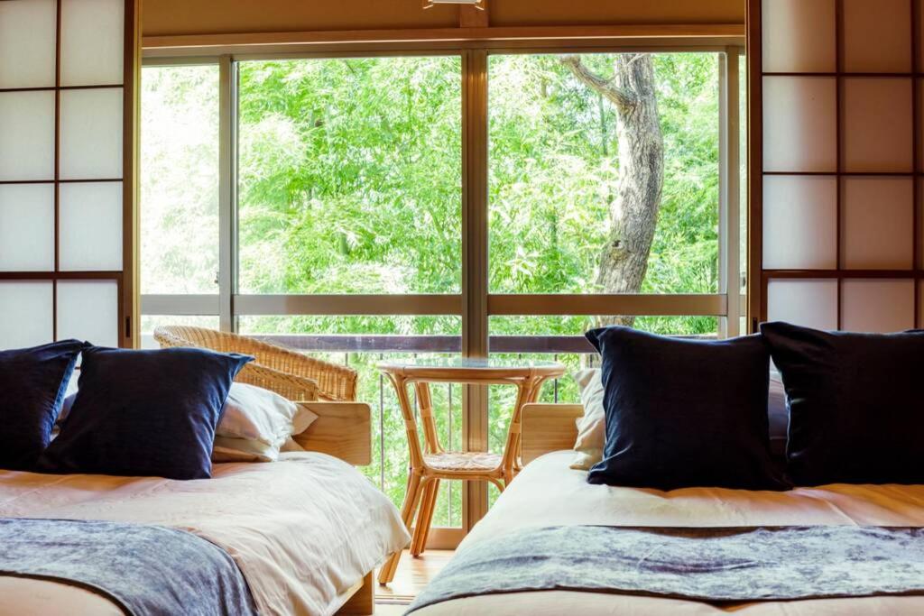 Кровать или кровати в номере Atami Bamboo Hill