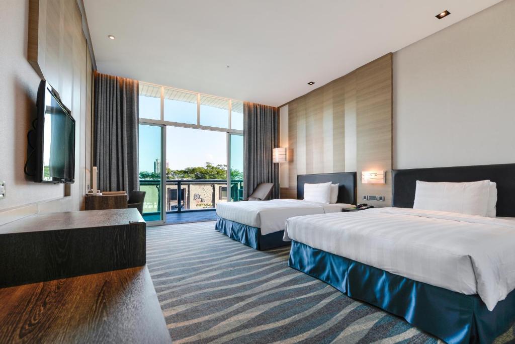 Postel nebo postele na pokoji v ubytování City Suites - Kaohsiung Chenai