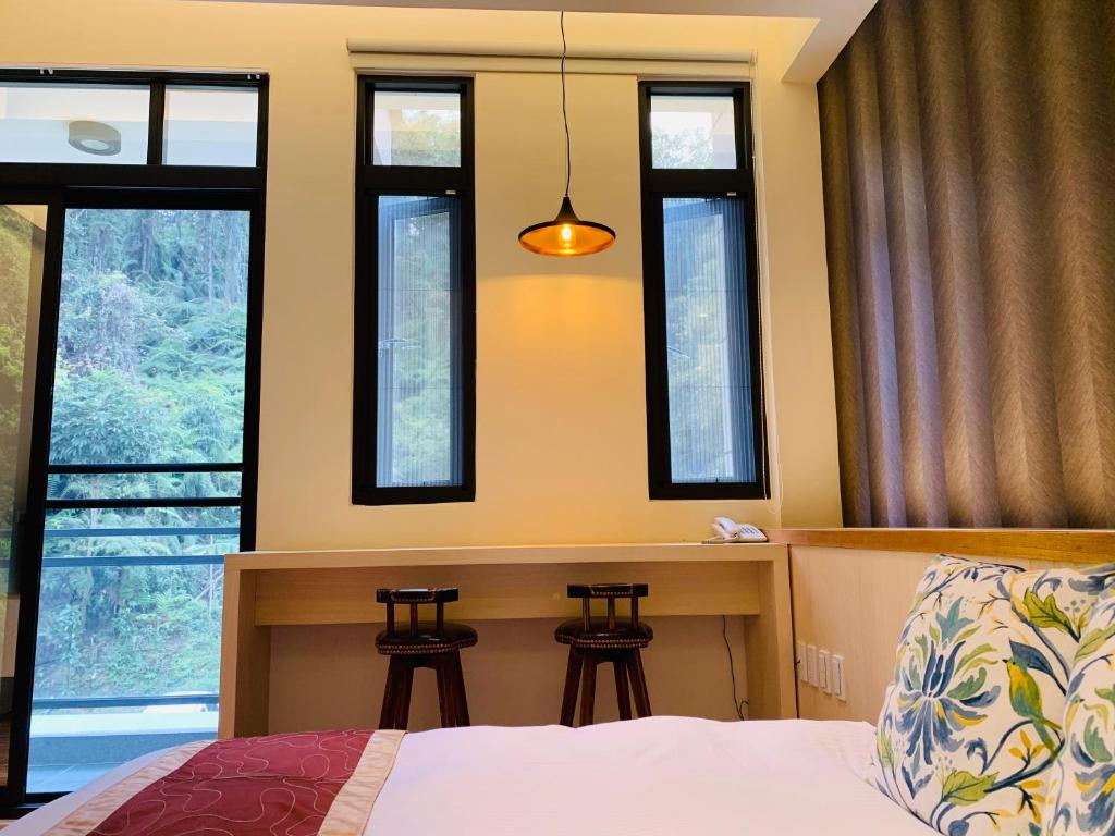 Postel nebo postele na pokoji v ubytování 日月潭沅居民宿 YUAN JU BOUTIQUE Hotel