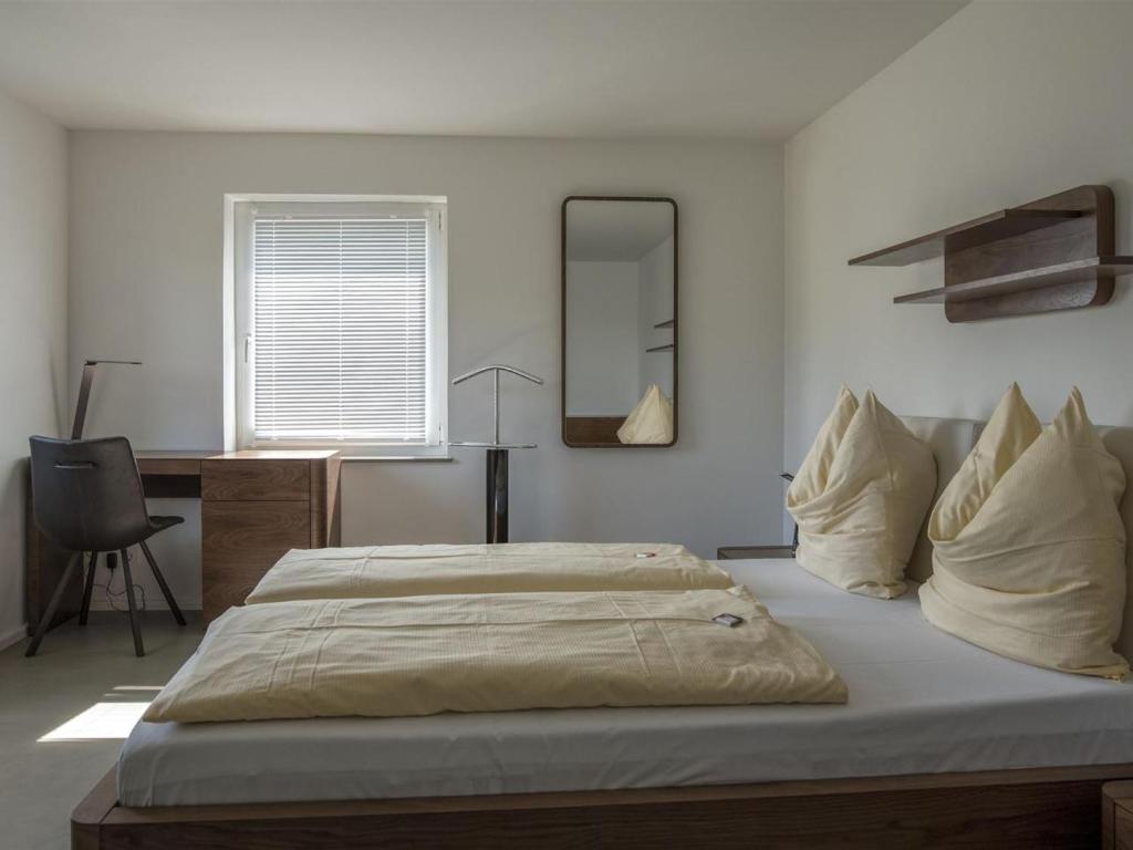 Postel nebo postele na pokoji v ubytování Ferienwohnung Buchenberg